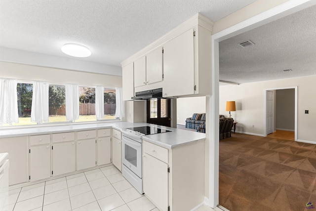 kitchen with visible vents, white electric stove, light countertops, under cabinet range hood, and a textured ceiling