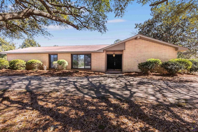 view of front of home featuring brick siding and entry steps