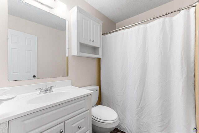 bathroom featuring vanity, curtained shower, toilet, and a textured ceiling