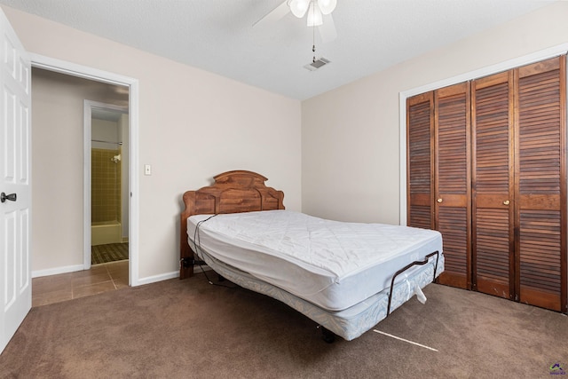 bedroom featuring visible vents, ceiling fan, baseboards, carpet, and a closet