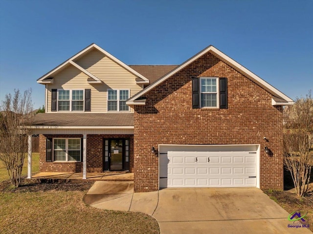 traditional-style home with brick siding, covered porch, concrete driveway, and an attached garage