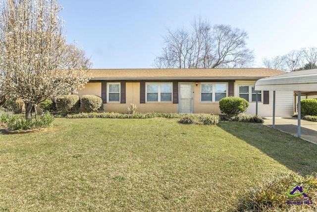 single story home with a front lawn, a carport, and brick siding