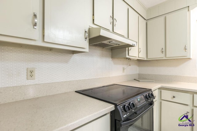 kitchen with white cabinetry, light countertops, black range with electric stovetop, and under cabinet range hood