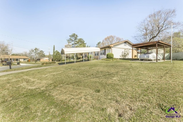 view of yard featuring a detached carport