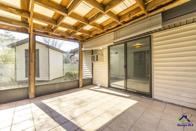 view of patio / terrace featuring an outdoor structure and fence