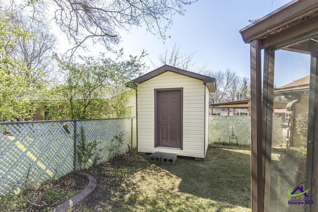 view of shed featuring a fenced backyard