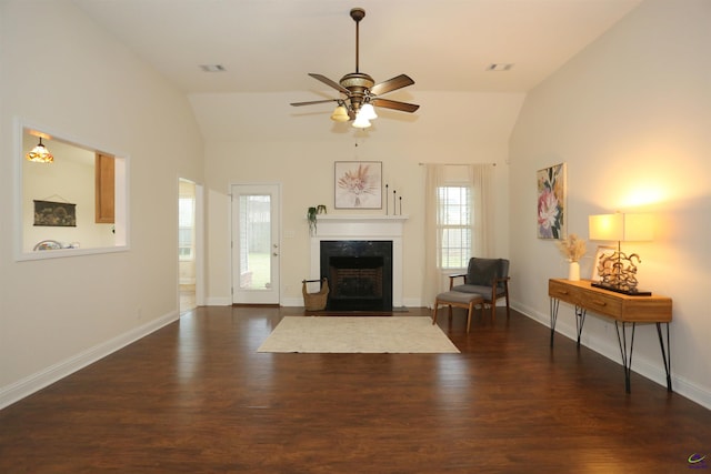 living room with visible vents, wood finished floors, and vaulted ceiling