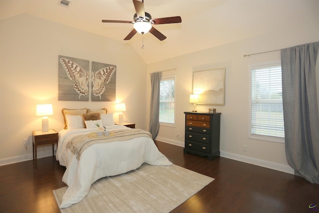 bedroom featuring ceiling fan, baseboards, lofted ceiling, and wood finished floors