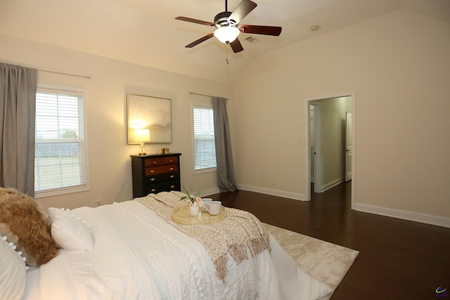 bedroom featuring vaulted ceiling, multiple windows, baseboards, and dark wood-style flooring