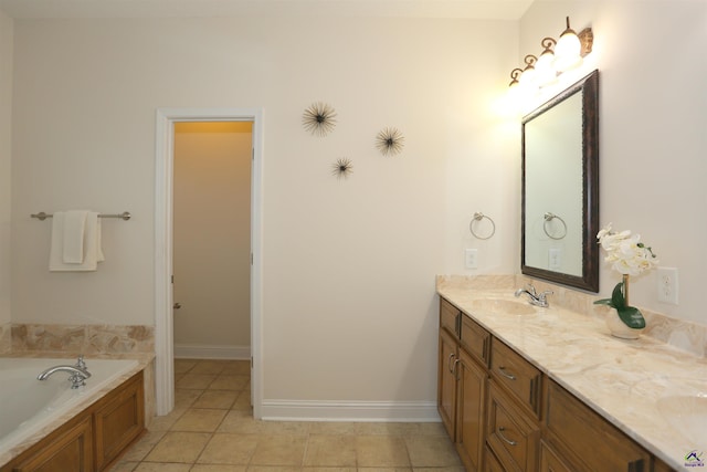 bathroom with double vanity, a bath, baseboards, and a sink