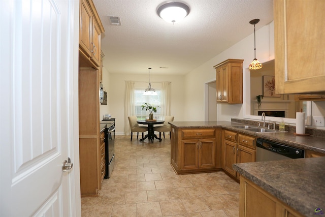 kitchen with visible vents, a sink, dark countertops, appliances with stainless steel finishes, and brown cabinetry