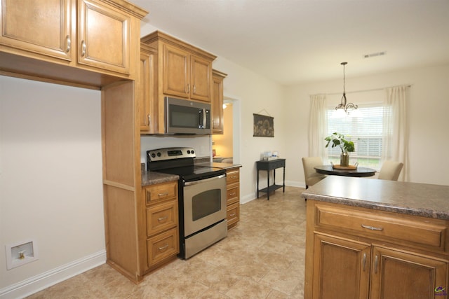 kitchen with brown cabinetry, visible vents, stainless steel appliances, dark countertops, and decorative light fixtures