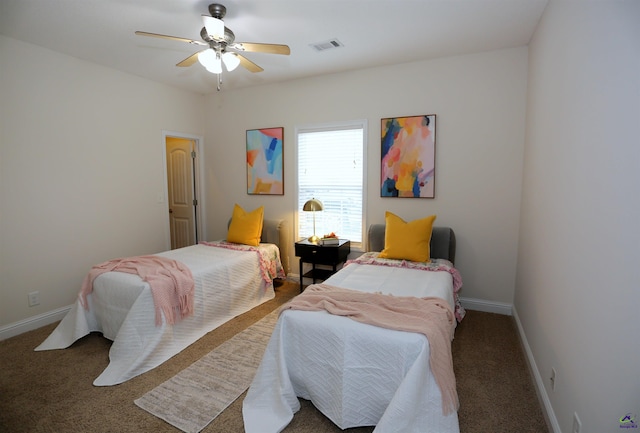 bedroom featuring visible vents, baseboards, carpet floors, and ceiling fan