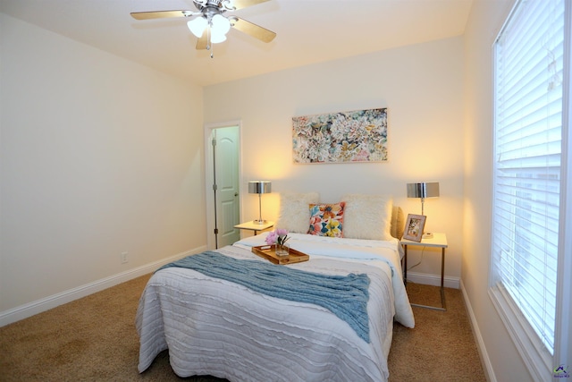 bedroom featuring carpet flooring, baseboards, and ceiling fan