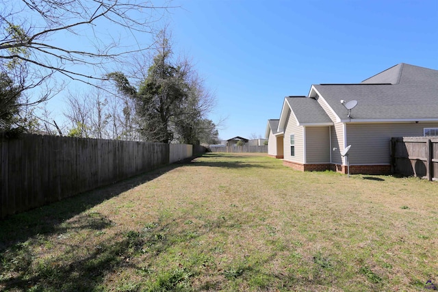 view of yard featuring a fenced backyard