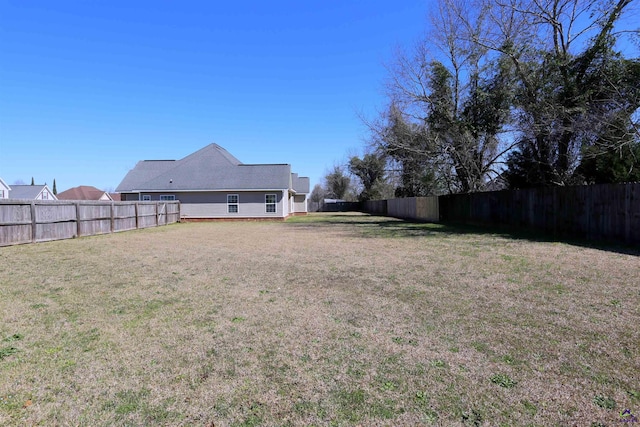 view of yard featuring a fenced backyard