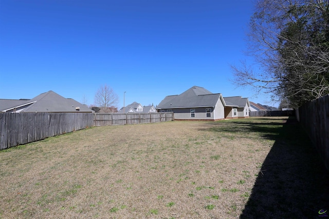 view of yard featuring a fenced backyard