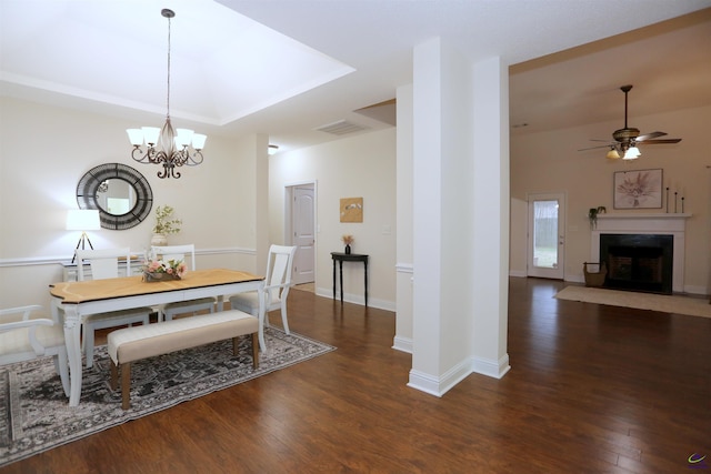 dining room with visible vents, wood finished floors, ceiling fan, and a premium fireplace