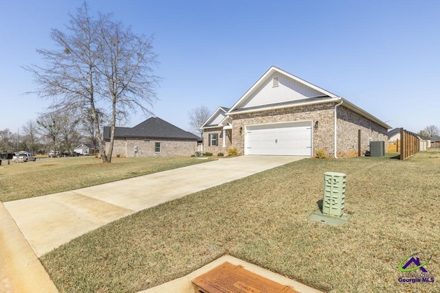 view of front facade featuring a front yard, driveway, an attached garage, central AC, and brick siding