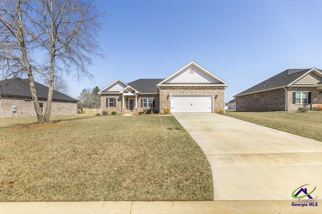 craftsman house with a front lawn, concrete driveway, brick siding, and an attached garage