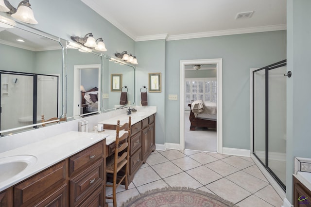 ensuite bathroom featuring tile patterned flooring, a shower stall, vanity, ornamental molding, and ensuite bath