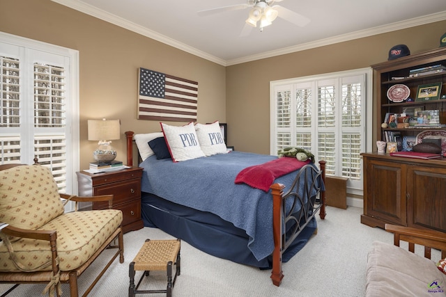 bedroom with light colored carpet, crown molding, and ceiling fan