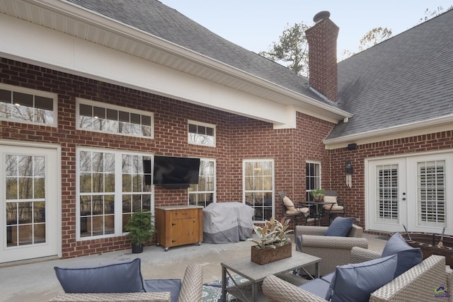 view of patio / terrace with an outdoor living space and a grill