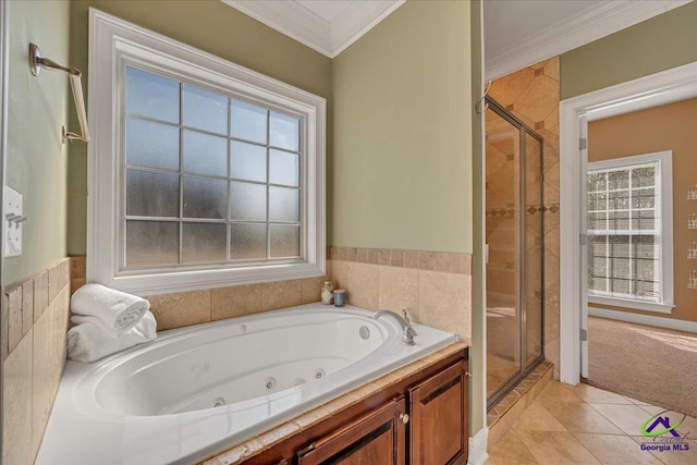 bathroom featuring tile patterned flooring, a whirlpool tub, a shower stall, and crown molding