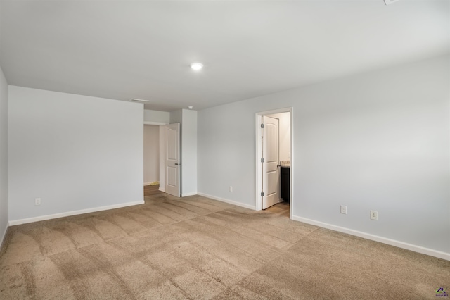 unfurnished bedroom featuring visible vents, carpet, baseboards, and connected bathroom