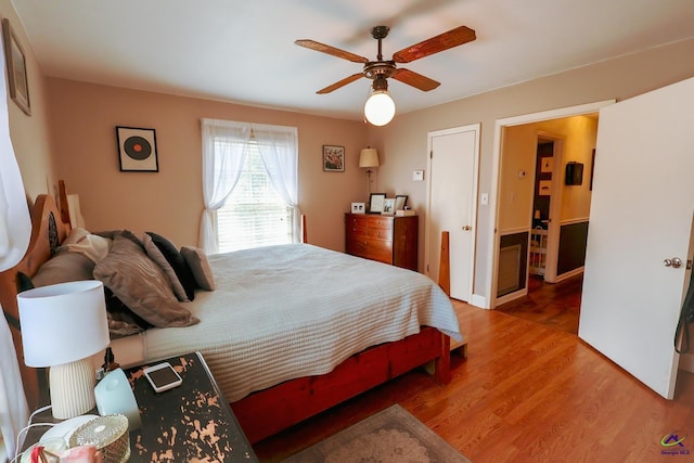 bedroom featuring ceiling fan and wood finished floors