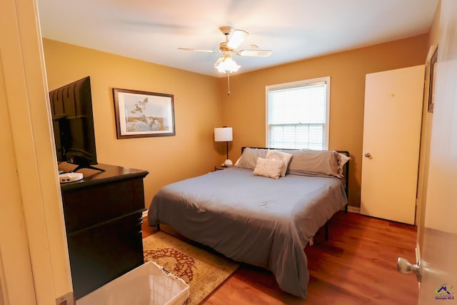 bedroom featuring a ceiling fan and light wood-style floors