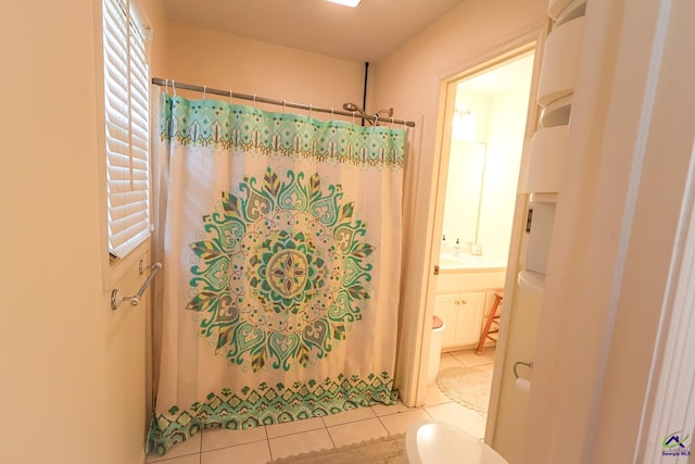 bathroom with tile patterned floors and a shower with curtain