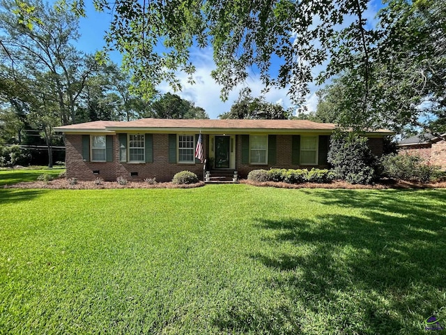 ranch-style home featuring crawl space, brick siding, and a front yard