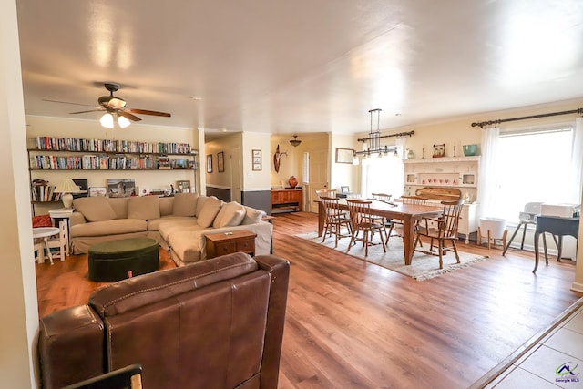 living room featuring ceiling fan and light wood-style floors