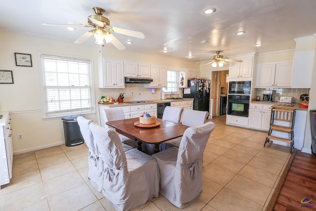 dining area with a ceiling fan, recessed lighting, light tile patterned flooring, crown molding, and baseboards