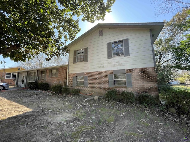 view of front of home featuring brick siding