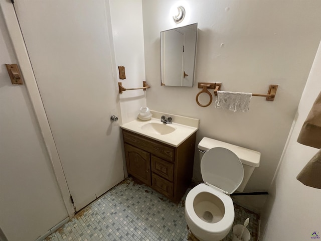 bathroom with toilet and vanity