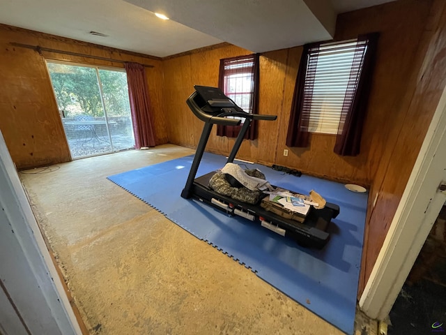 workout area featuring wooden walls and visible vents