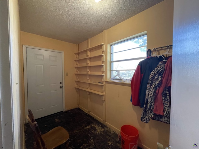 interior space with a textured ceiling