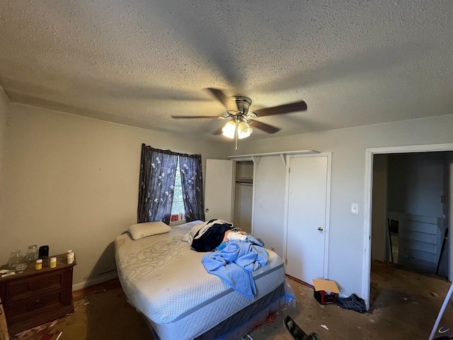 bedroom featuring a ceiling fan, a closet, and a textured ceiling