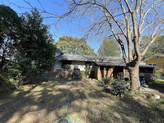 exterior space with brick siding