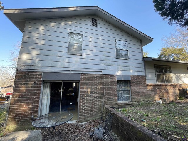 back of property with brick siding