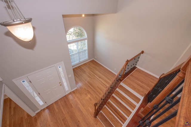 entrance foyer with light wood-type flooring and baseboards