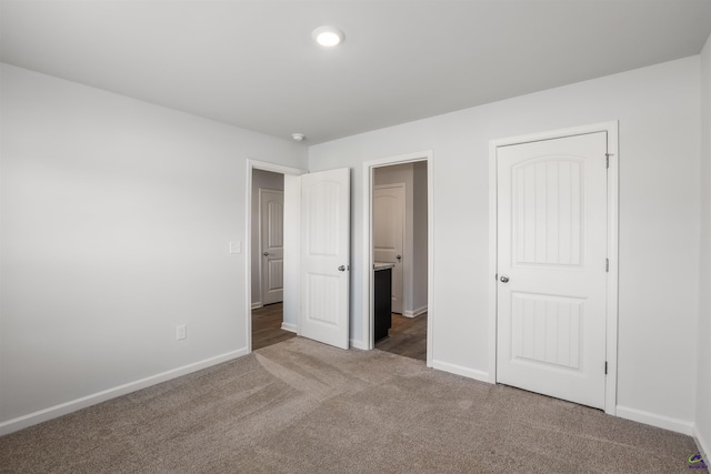 unfurnished bedroom featuring baseboards and carpet floors