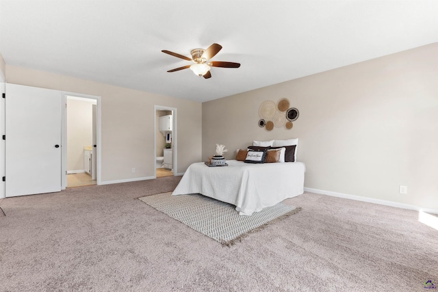 unfurnished bedroom featuring ensuite bathroom, baseboards, carpet floors, and ceiling fan