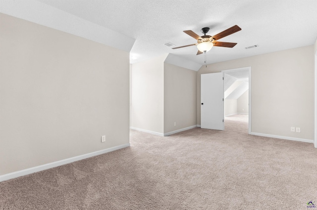 spare room featuring visible vents, baseboards, a ceiling fan, and carpet flooring