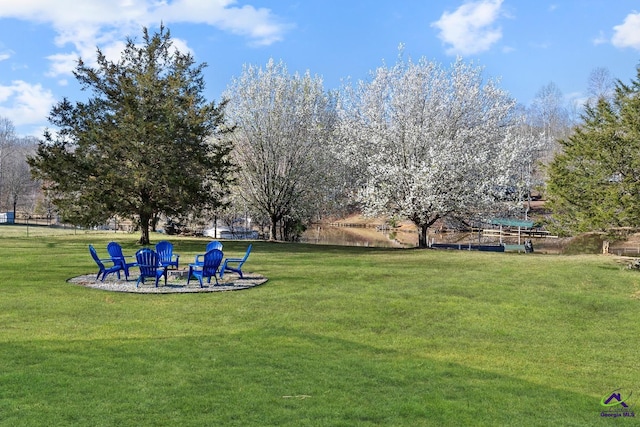 view of yard with a fire pit