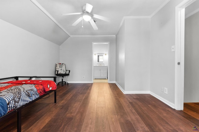 bedroom with baseboards, wood-type flooring, ensuite bathroom, and crown molding