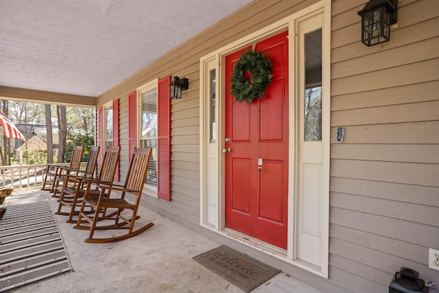 doorway to property featuring a porch