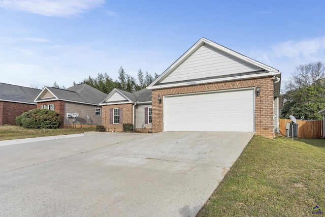 view of front of property with a front yard, fence, driveway, a garage, and brick siding